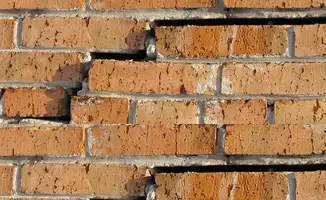 Brick wall with serious structural damage in Bloomington, IN