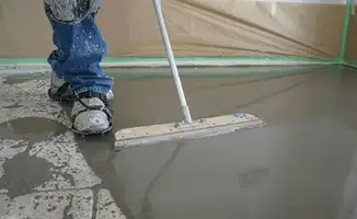 Uneven floor being professionally repaired in Bloomington, IN